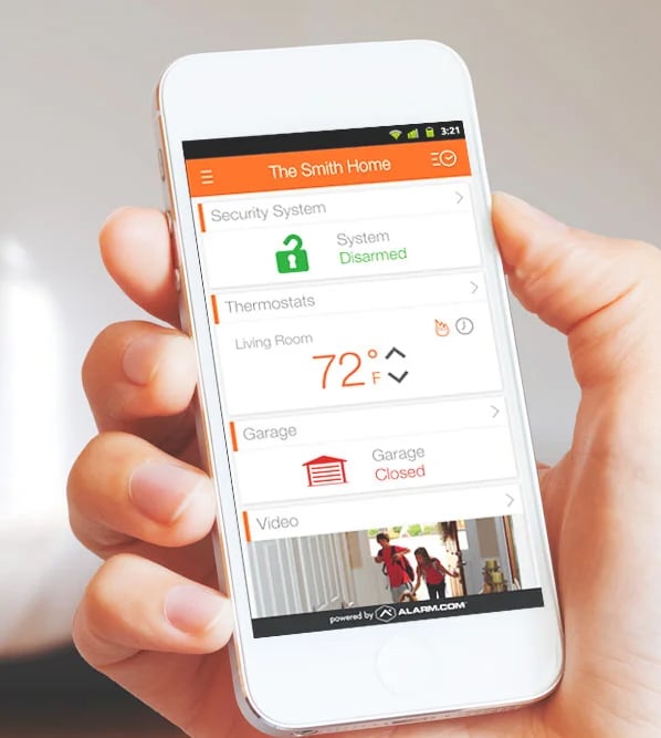 User with Alarm.com app on iphone